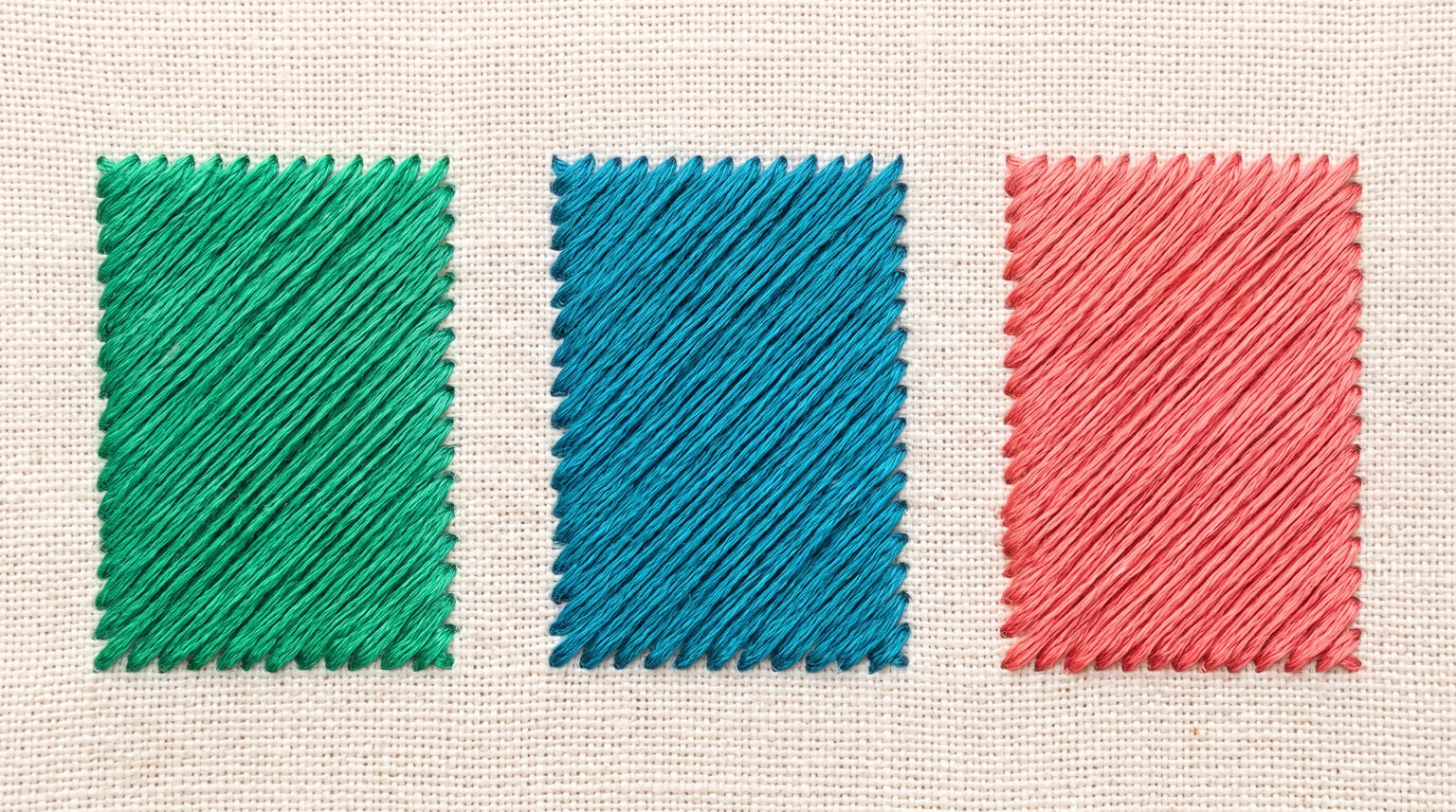 Green, teal and coral rectangular satin fills with parallel diagonal stitches